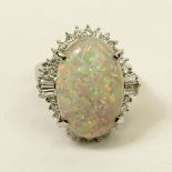 Lady's Approx. 8.31 Carat Oval Cut White Opal, .86 Carat Diamond and Platinum Ring. Opal with good