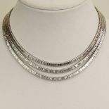 Lady's Vintage Approx. 55.0 carat Baguette Cut Diamond and Platinum Three (3) Strand Necklace.