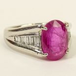4.92 Carat Oval Cut Burma Ruby, .45 Carat Baguette Cut Diamond and Platinum Ring. Ruby with good