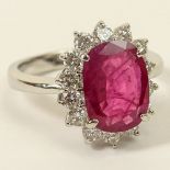 3.12 Carat Oval Cut Ruby, .94 Carat Round Brilliant Cut Diamond and Platinum Ring. Ruby with vivid
