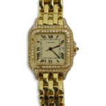 Lady's Cartier 18 Karat Yellow Gold Panther Watch with Diamond Bezel and Quartz Movement. Signed 18K