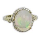 Approx. 3.09 Carat White Opal, Diamond and 14 Karat Yellow Gold Ring. Signed 14K. Very good