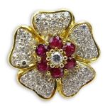 Round Brilliant Cut Diamond, Ruby and 18 Karat Yellow Gold Flower Ring. Rubies with vivid saturation