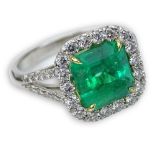 Approx. 3.03 Carat Square Cut Colombian Emerald and Platinum Ring accented throughout with Round