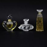 Lot of Three (3) Lalique Crystal Perfume Bottles. Signed. Good condition. Measures 5" H, 4" H, 3" H.