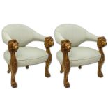 Pair of Italian Style Carved Wood and Upholstered Arm Chairs. Both are decorated with lion head