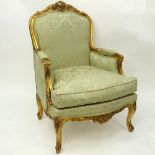 20th Century Wood Carved Gold Leaf Upholstered Bergere Chair. Good condition. Measures 40" H x 28"