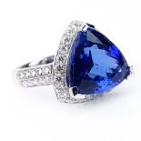 GIA and AIG Certified 8.82 Carat Triangular Brilliant Cut Tanzanite .91 Carat Round Brilliant Cut