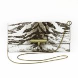 Reed Krakoff Dyed Calf Hair Clutch Purse. Wrap around closure, impressed logo on interior,