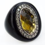 Oval Cut Citrine, Round Cut Diamond, Resin and 14 Karat White Gold Ring. Signed CV 14K. Very good