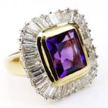 Emerald Cut Amethyst, Baguette Cut Diamond and 14 Karat Yellow Gold Ring. Amethyst with vivid