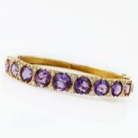 Vintage Round Cut Amethyst, Diamond and 14 Karat Yellow Gold Hinged Bangle Bracelet. Stamped 14K.