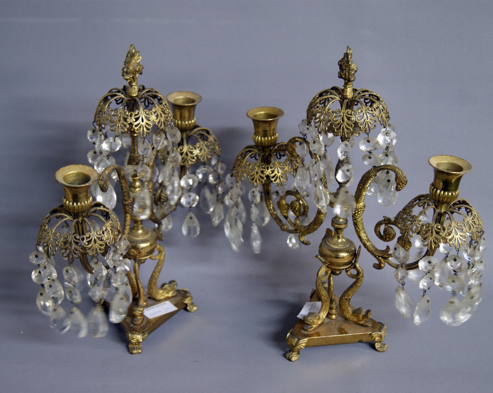 A pair of gilt-brass candelabra, each having cut-glass graduated drops CONDITION REPORT; Available