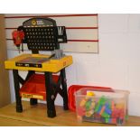 Box of Mega blocks and a children's workbench