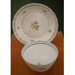 An 18th Century English tea bowl and saucer, decorated with flora and gilt details, each having a