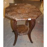 Heavily carved octagonal occasional table