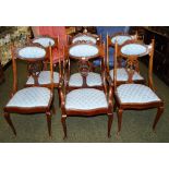 A set of six Victorian mahogany carved dining chairs,