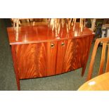 A reproduction mahogany two door fitted sideboard