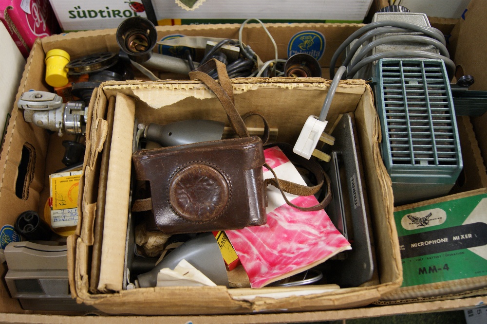 A box of mixed vintage photography accessories