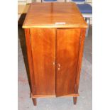 A mahogany two door cupboard