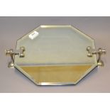 An Art Deco octagonal bathroom mirror with chrome wall mounting brackets CONDITION REPORT; From a