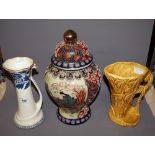 Charlotte Rhead, a painted and glazed water-jug and a Sylvac jug (both a/f), together with an