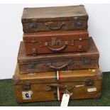 A vintage brown suitcase with shipping labels,