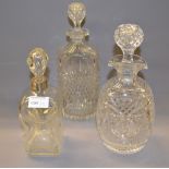 Three good-quality cut-glass decanters with their respective stoppers,