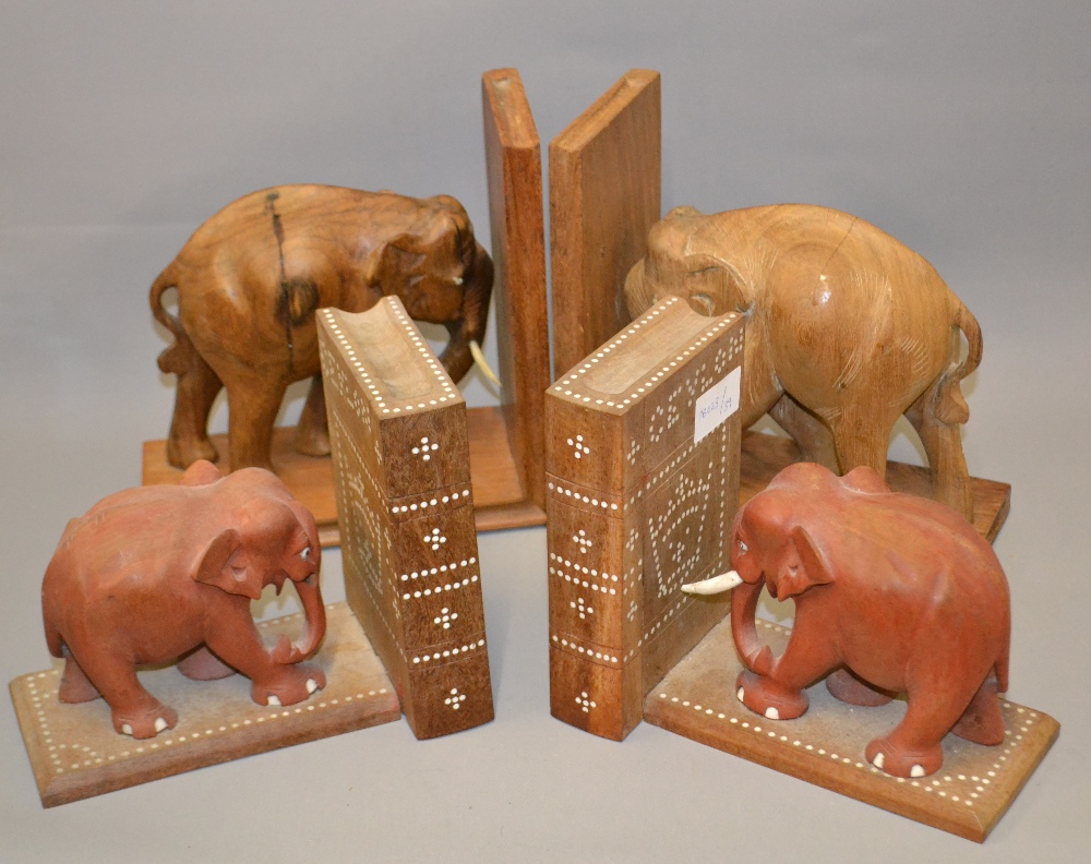 Two carved pairs of bookends