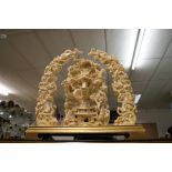 An exceptionally large oriental relief decorated centre-piece displaying dragons,