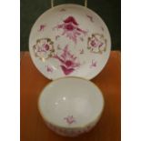 A tea bowl and saucer, unmarked but likely Newhall, decorated with flora and gilt details, each