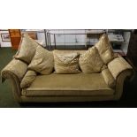 Alan Ward, Chester, a gold coloured three-seater sofa with scatter-cushions,