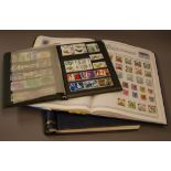 A philatelic collection of Worldwide stamps, within two albums and an ACE stockbook CONDITION