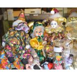 A selection of clown puppets and dolls,