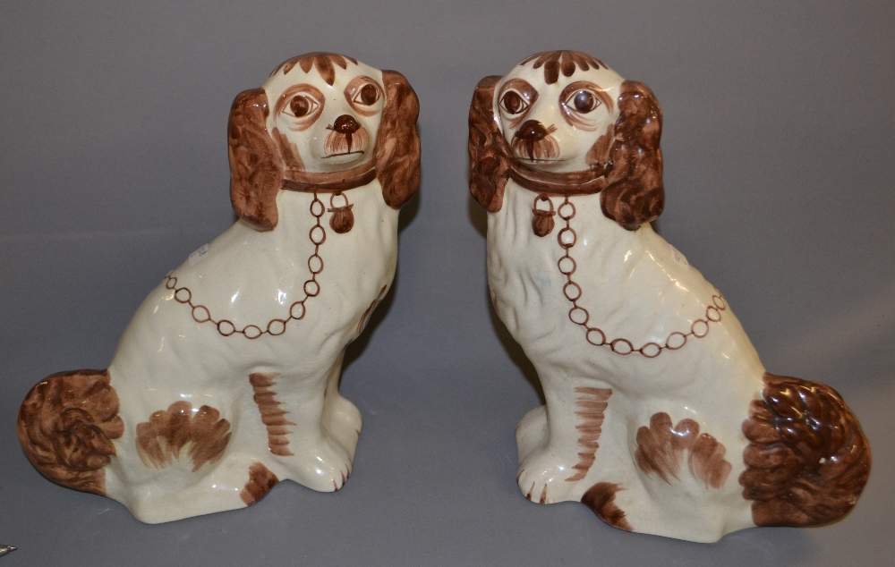 A pair of reproduction Staffordshire dogs