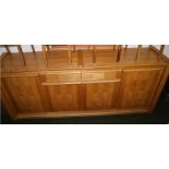 A contemporary oak sideboard of approximately 8ft comprising of cupboards and drawers