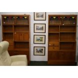 Two vintage teak book cases, each having