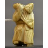 A 19th Century carved bone oriental Netsuke,