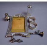 Mixed silver, to include two napkin rings, a pepperette, a mounted photograph frame,