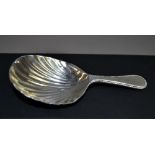 A silver caddy spoon;