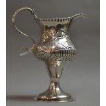 A silver cream jug; London 1786, later embossed.