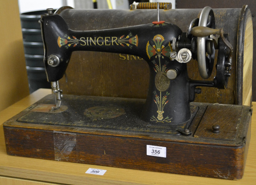 An oak cased Singer sewing machine