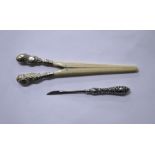 A silver mounted ivory gloves stretcher, Birmingham. Along with a silver mounted cuticle tool.