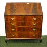 A flamed mahogany fall front bureau with fitted interior and four drawers.