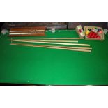 A quarter size vintage slate bed table-top snooker table with both snooker and billiard balls, cues,