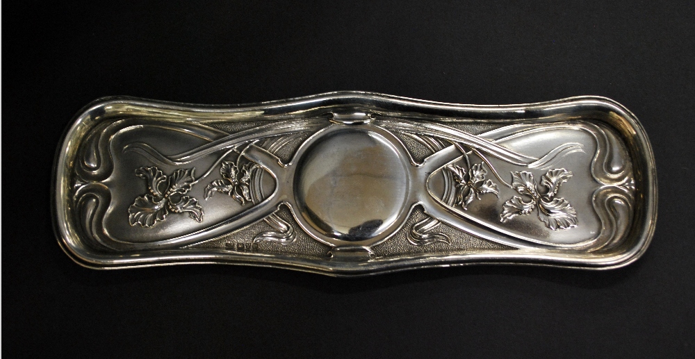 Hallmarked silver pin tray, relief decorated in the Art Nouveau style.