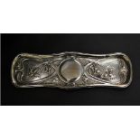 Hallmarked silver pin tray, relief decorated in the Art Nouveau style.