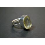 A silver and citrine dress ring.