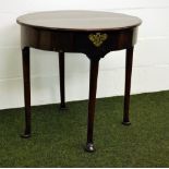 A William IV mahogany fold-over demi-lune table with storage compartment within