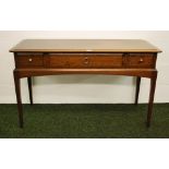 A mahogany three drawer writing desk